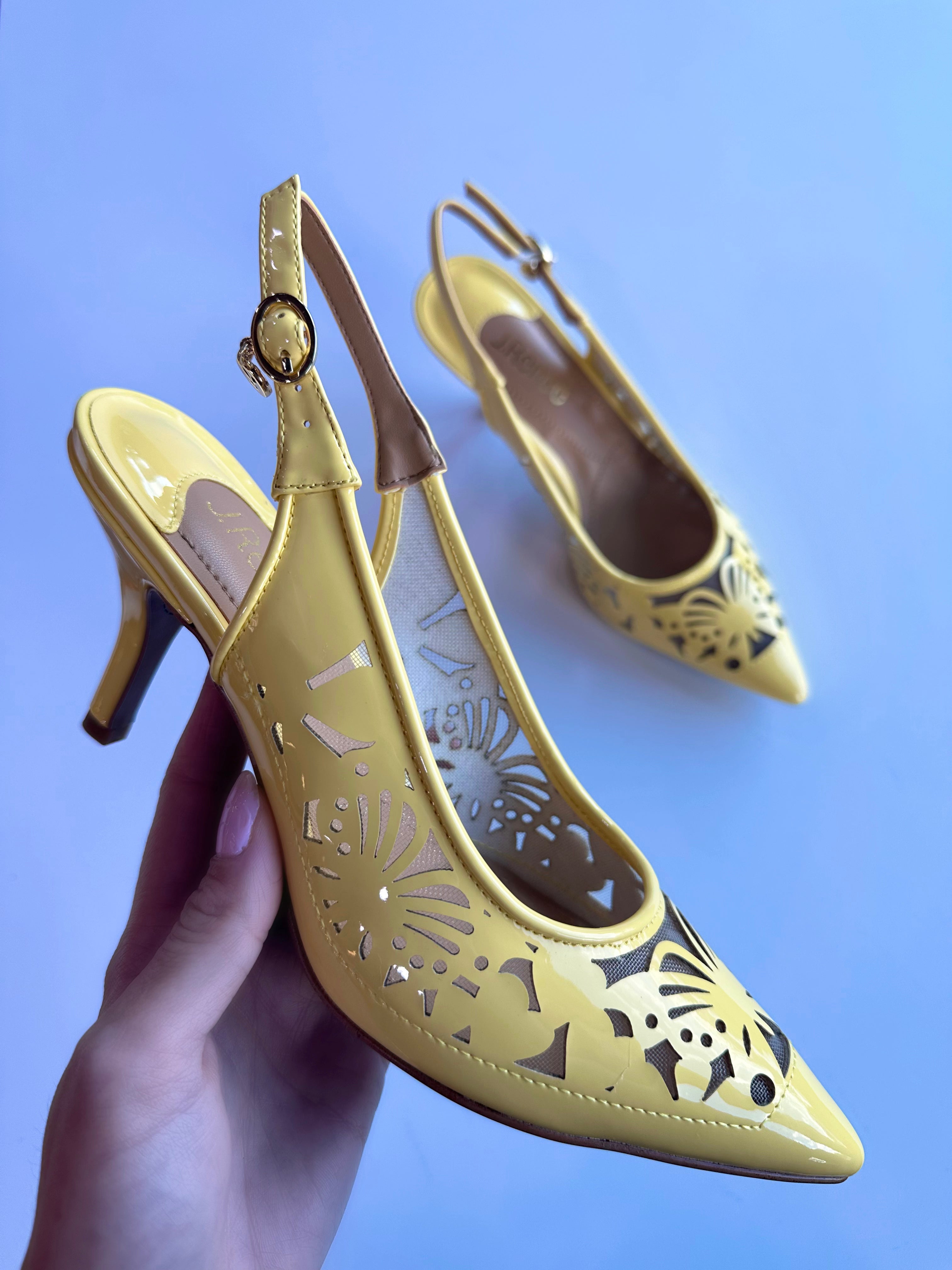 J. Renee Vanani Tangerine Village Shoe Inn